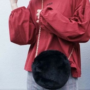 Round furry crossbody. [Available in white or blac